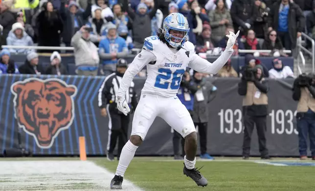 Detroit Lions running back Jahmyr Gibbs celebrates his touchdown during the first half of an NFL football game against the Chicago Bears on Sunday, Dec. 22, 2024, in Chicago. (AP Photo/Nam Y. Huh)