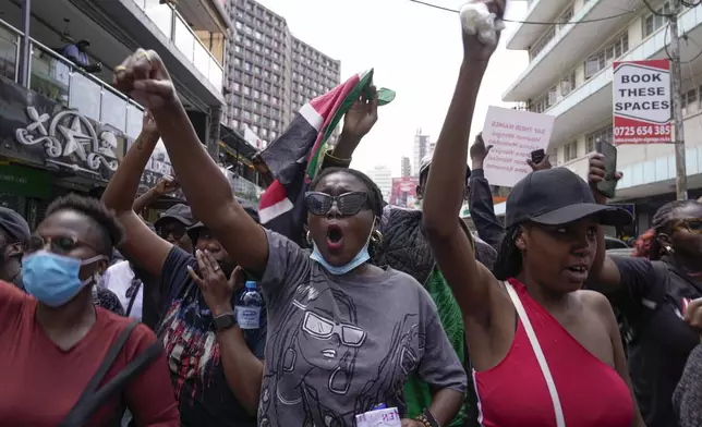 Demonstrators chant during a march against the rising cases of femicide, in downtown Nairobi, Kenya, Tuesday, Dec. 10, 2024. (AP Photo/Brian Inganga)