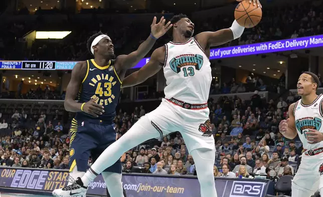 Memphis Grizzlies forward Jaren Jackson Jr. (13) grabs a rebound against Indiana Pacers forward Pascal Siakam (43) in the first half of an NBA basketball game Sunday, Dec. 1, 2024, in Memphis, Tenn. (AP Photo/Brandon Dill)