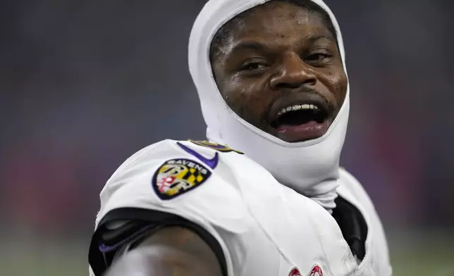 Baltimore Ravens quarterback Lamar Jackson reacts on the sideline during the second half of an NFL football game against the Houston Texans, Wednesday, Dec. 25, 2024, in Houston. (AP Photo/David J. Phillip)