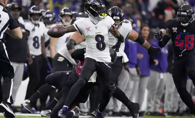 Baltimore Ravens quarterback Lamar Jackson (8) throws a pass during the first half of an NFL football game against the Houston Texans, Wednesday, Dec. 25, 2024, in Houston. (AP Photo/Eric Christian Smith)