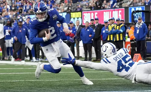 New York Giants quarterback Drew Lock (2) gets past Indianapolis Colts linebacker E.J. Speed (45) to score a touchdown on a 5-yard run in the second half of an NFL football game Sunday, Dec. 29, 2024, in East Rutherford, N.J. (AP Photo/Seth Wenig)