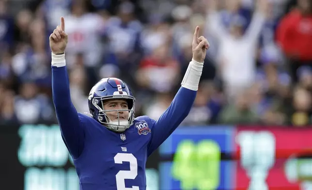 New York Giants quarterback Drew Lock (2) reacts after a touchdown pass during an NFL football game against the Indianapolis Colts Sunday, Dec. 29, 2024, in East Rutherford, N.J. (AP Photo/Adam Hunger)