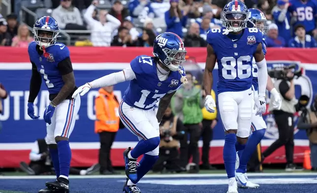 New York Giants wide receiver Wan'Dale Robinson (17) celebrates after scoring a touchdown against the Indianapolis Colts in the first half of an NFL football game Sunday, Dec. 29, 2024, in East Rutherford, N.J. (AP Photo/Seth Wenig)