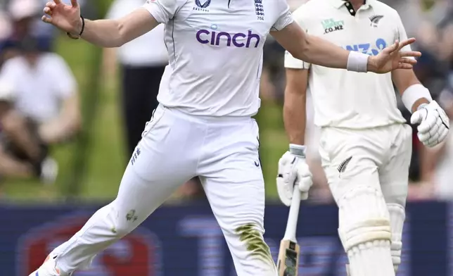 England's Matthew Potts reacts during play on day one of the third cricket test between England and New Zealand in Hamilton, New Zealand, Saturday, Dec. 14, 2024. (Andrew Cornaga/Photosport via AP)