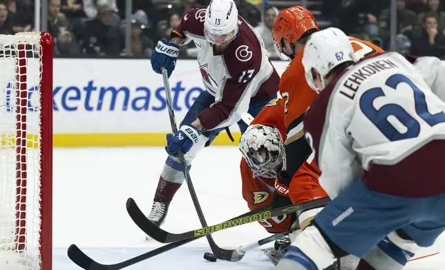 Colorado Avalanche right wing Valeri Nichushkin (13) scores past Anaheim Ducks goaltender John Gibson (36) during the second period of an NHL hockey game, Friday, Dec. 20, 2024, in Anaheim, Calif. (AP Photo/Kyusung Gong)