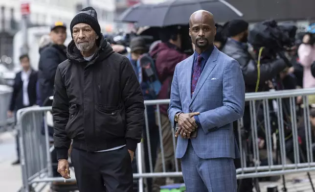 Andre Zachary, father of Jordan Neely, and attorney Donte Mills outside the criminal court, Monday, Dec. 9, 2024, in New York. (AP Photo/Stefan Jeremiah)
