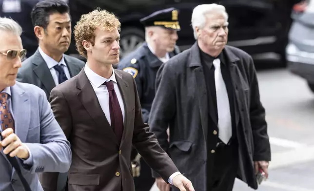 Daniel Penny, center, arrives at criminal court, Monday, Dec. 9, 2024, in New York. (AP Photo/Stefan Jeremiah)