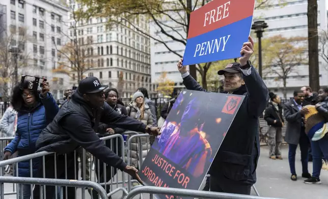 Rival protesters for the Daniel Penny trial gather outside the criminal court, Monday, Dec. 9, 2024, in New York. (AP Photo/Stefan Jeremiah)