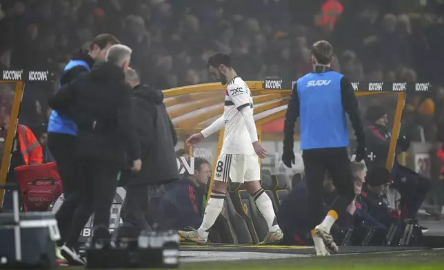 Manchester United's Bruno Fernandes heads down the tunnel after being sent off during the English Premier League soccer match between Wolverhampton Wanderers and Manchester United at the Molineux Stadium, Wolverhampton, England, Thursday, Dec. 26, 2024. (David Davies/PA via AP)