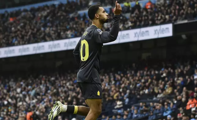 Everton's Iliman Ndiaye celebrates scoring his side's first goal during the English Premier League soccer match between Manchester City and Everton at the Etihad stadium in Manchester, Thursday, Dec. 26, 2024. (AP Photo/Rui Vieira)