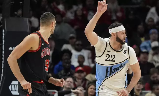 Atlanta Hawks forward Larry Nance Jr. (22) celebrates a basket against the Chicago Bulls during the first half of an NBA basketball game, Thursday, Dec. 26, 2024, in Atlanta. (AP Photo/Mike Stewart)