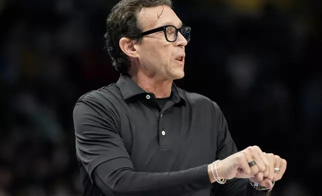 Atlanta Hawks head coach Quin Snyder speaks to players during the first half of an NBA basketball game against the Chicago Bulls, Thursday, Dec. 26, 2024, in Atlanta. (AP Photo/Mike Stewart)