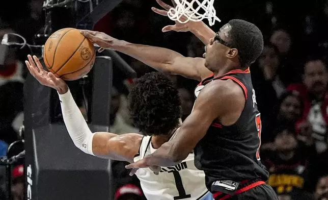 Atlanta Hawks forward Jalen Johnson (1) shoots against Chicago Bulls forward Jalen Smith (7) during the first half of an NBA basketball game, Thursday, Dec. 26, 2024, in Atlanta. (AP Photo/Mike Stewart)