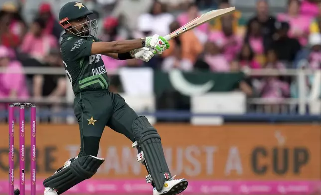 Pakistan's Babar Azam watches his stroke shot during the third International cricket match between South Africa and Pakistan, at the Wanderers stadium in Johannesburg, South Africa, Sunday, Dec. 22, 2024. (AP Photo/Themba Hadebe)