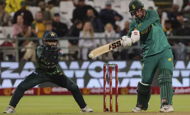 Pakistan wicketkeeper Muhammad Rizwan watches as South African batsman Heinrich Klaasen plays a shot during the second ODI International cricket match between South Africa and Pakistan in Cape Town, South Africa, Thursday, Dec. 19, 2024. (AP Photo/Halden Krog)