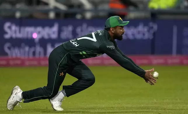 Pakistan's Abdullah Shafique takes a catch too dismiss South Africa's Bjorn Fortuin for 8 runs during the third International cricket match between South Africa and Pakistan, at the Wanderers stadium in Johannesburg, South Africa, Sunday, Dec. 22, 2024. (AP Photo/Themba Hadebe)