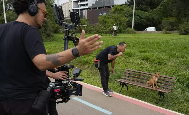 Crew members work on the set of the Netflix film "Caramelo," in Sao Paulo, Tuesday, Oct. 29, 2024. (AP Photo/Andre Penner)