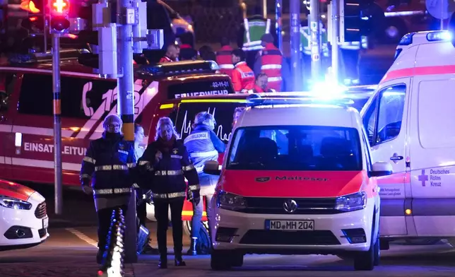 Emergency services work in a cordoned-off area near a Christmas Market, after an incident in Magdeburg, Germany, Friday, Dec. 20, 2024. (AP Photo/Ebrahim Noroozi)