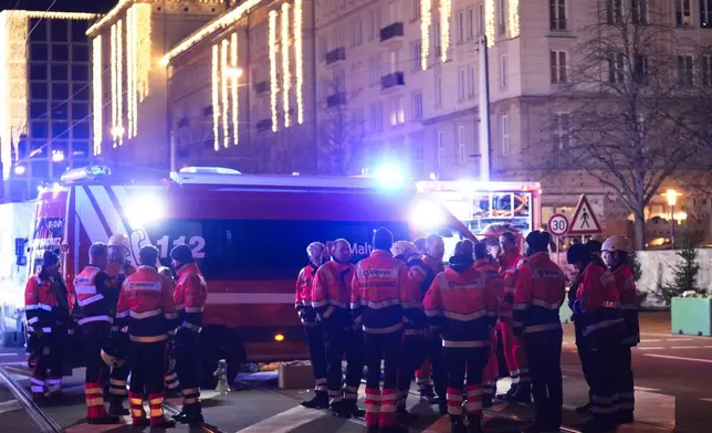 Emergency services work in a cordoned-off area near a Christmas Market, after a car drove into a crowd in Magdeburg, Germany, Friday, Dec. 20, 2024. (AP Photo/Ebrahim Noroozi)