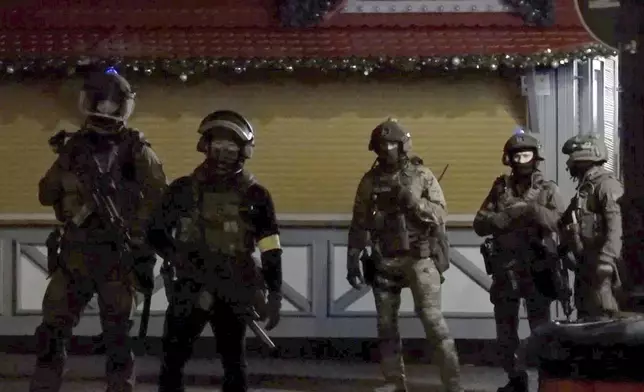 In this screen grab image from video, special police forces attend an incident at the Christmas market in Magdeburg, Germany, Friday Dec. 20, 2024. (Thomas Schulz/dpa via AP)