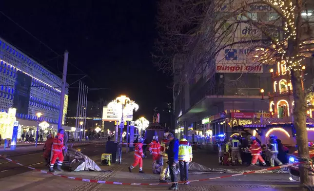 Emergency services attend an incident at the Christmas market in Magdeburg, Germany, Friday Dec. 20, 2024. (Dörthe Hein/dpa via AP)