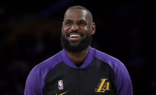 Los Angeles Lakers forward LeBron James (23) warms up before an NBA basketball game against the Detroit Pistons in Los Angeles, Monday, Dec. 23, 2024. (AP Photo/Eric Thayer)