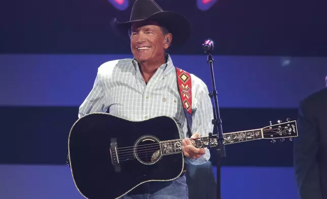 FILE - George Strait performs at the iHeartCountry Festival on Saturday, Oct. 30, 2021, at the Frank Erwin Center in Austin, Texas. (Photo by Jack Plunkett/Invision/AP, File)