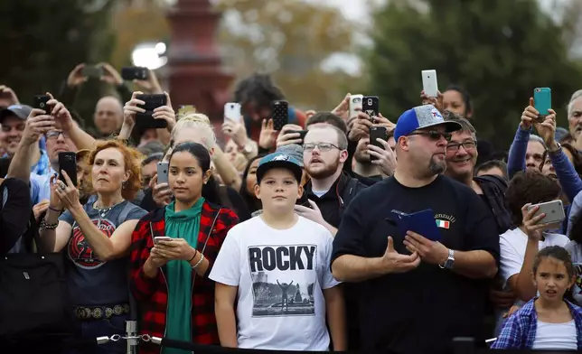 FILE - Fans gather near a press conference where cast members Michael B. Jordan, Sylvester Stallone and Tessa Thompson are promoting their film "Creed" outside the Philadelphia Museum of Art, Friday, Nov. 6, 2015, in Philadelphia. (AP Photo/Matt Slocum)