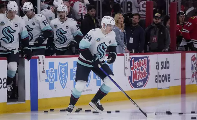 Seattle Kraken's Kaapo Kakko warms up before an NHL hockey game against the Chicago Blackhawks in Chicago, Thursday, Dec. 19, 2024. (AP Photo/Nam Y. Huh)