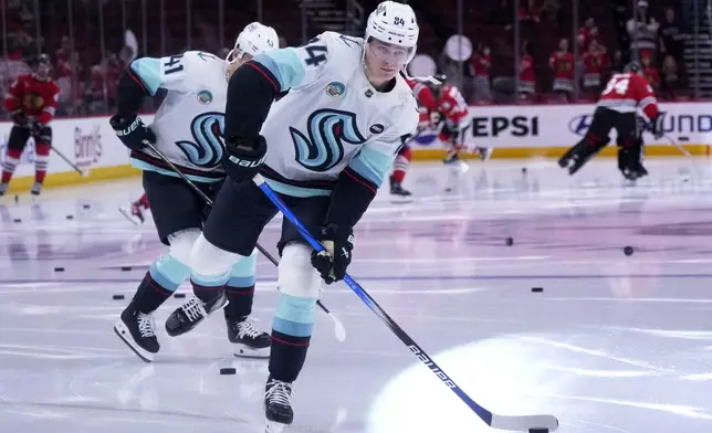 Seattle Kraken's Kaapo Kakko (84) warms up before an NHL hockey game against the Chicago Blackhawks in Chicago, Thursday, Dec. 19, 2024. (AP Photo/Nam Y. Huh)