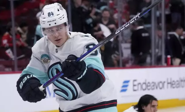 Seattle Kraken's Kaapo Kakko (84) warms up before an NHL hockey game against the Chicago Blackhawks in Chicago, Thursday, Dec. 19, 2024. (AP Photo/Nam Y. Huh)