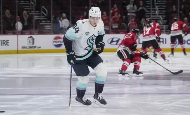 Seattle Kraken's Kaapo Kakko (84) warms up before an NHL hockey game against the Chicago Blackhawks in Chicago, Thursday, Dec. 19, 2024. (AP Photo/Nam Y. Huh)