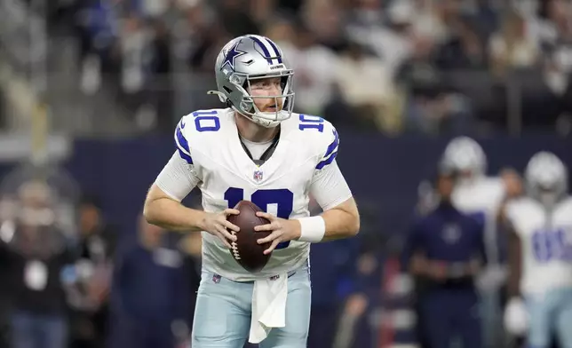 Dallas Cowboys quarterback Cooper Rush looks to throw a pass in the first half of an NFL football game against the Tampa Bay Buccaneers in Arlington, Texas, Sunday, Dec. 22, 2024. (AP Photo/Julio Cortez)