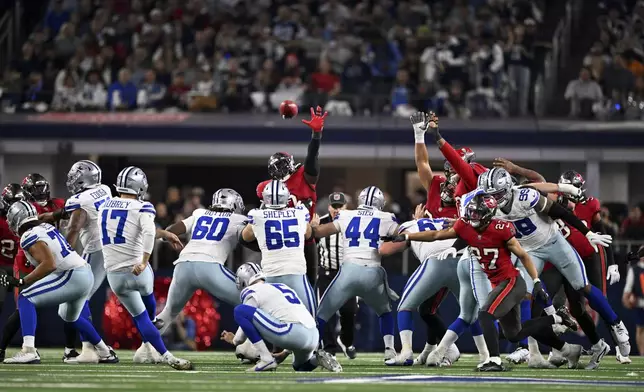 Dallas Cowboys place kicker Brandon Aubrey (17) kicks a 53-yard field goal in the second half of an NFL football game against the Tampa Bay Buccaneers in Arlington, Texas, Sunday, Dec. 22, 2024. (AP Photo/Jerome Miron)