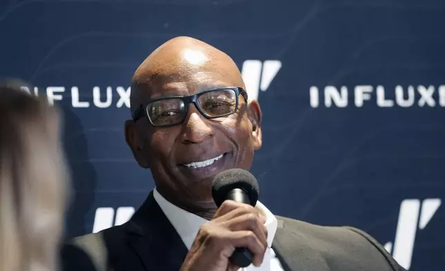 Former NFL and SMU running back Eric Dickerson speaks during a panel discussion about NIL and NCAA college football, Tuesday, Dec. 3, 2024, in Dallas. (AP Photo/LM Otero)