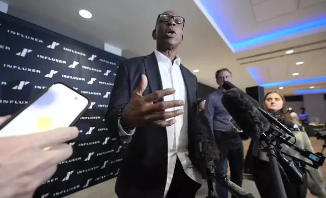 Former NFL and SMU running back Eric Dickerson speaks to media after a panel discussion about NIL and NCAA college football, Tuesday, Dec. 3, 2024, in Dallas. (AP Photo/LM Otero)