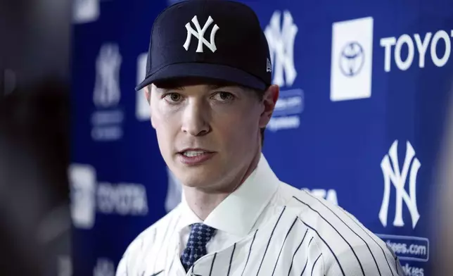 New York Yankees' Max Fried responds to questions during an interview at a baseball news conference, Wednesday, Dec. 18, 2024, in New York. (AP Photo/Frank Franklin II)