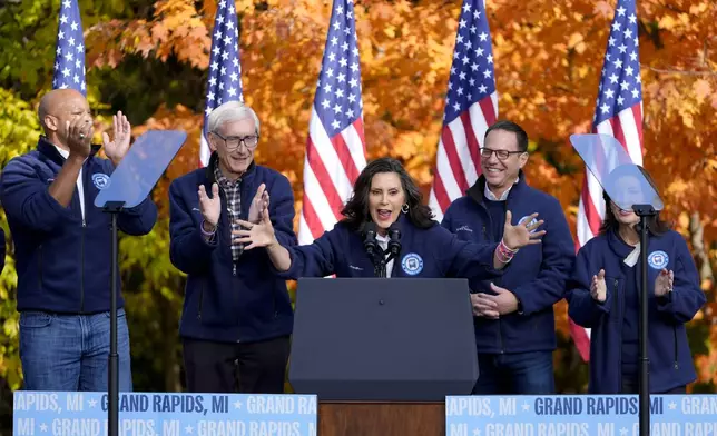 FILE - Michigan Gov. Gretchen Whitmer speaks, accompanied by Maryland Gov. Wes Moore, from left, Wisconsin Gov. Tony Evers, Pennsylvania Gov. Josh Shapiro and New York Gov. Kathy Hochul at a campaign event for Democratic presidential nominee Vice President Kamala Harris in Riverside Park, in Grand Rapids, Mich., Friday, Oct. 18, 2024. (AP Photo/Paul Sancya, File)