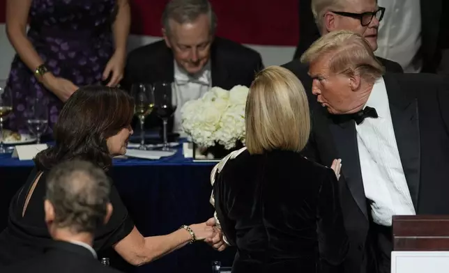 FILE - Republican presidential nominee former President Donald Trump shakes hands with New York Gov. Kathy Hochul at the 79th annual Alfred E. Smith Memorial Foundation Dinner, in New York, Oct. 17, 2024. (AP Photo/Julia Demaree Nikhinson, File)