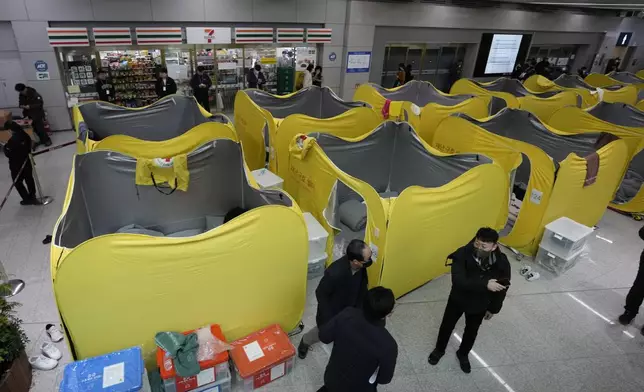 A temporary shelter for relatives of the passengers of a plane which burst into flames, is seen at Muan International Airport in Muan, South Korea, Monday, Dec. 30, 2024. (AP Photo/Ahn Young-joon)