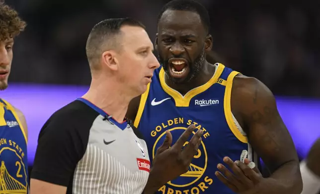 Golden State Warriors forward Draymond Green (23) argues with referee Justin Van Duyne (64) during the first half of an NBA basketball game against the Los Angeles Lakers, Wednesday, Dec. 25, 2024, in San Francisco. (AP Photo/Eakin Howard)