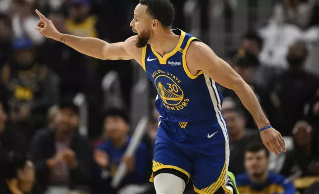 Golden State Warriors guard Stephen Curry (30) celebrates a three-point basket during the first half of an NBA basketball game against the Los Angeles Lakers, Wednesday, Dec. 25, 2024, in San Francisco. (AP Photo/Eakin Howard)