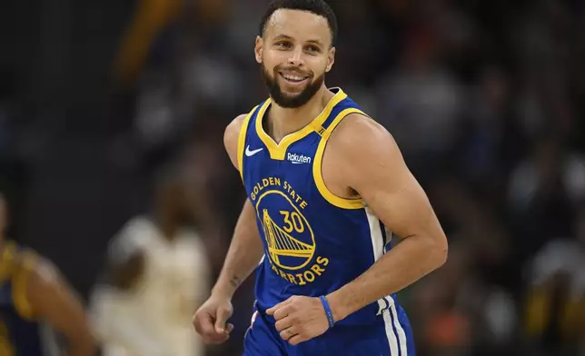 Golden State Warriors guard Stephen Curry (30) celebrates a three-point basket during the first half of an NBA basketball game against the Los Angeles Lakers, Wednesday, Dec. 25, 2024, in San Francisco. (AP Photo/Eakin Howard)