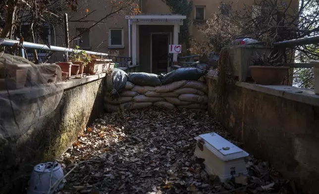 A house is blocked with protective sandbags in the community of Kibbutz Manara, located along the border with Lebanon, in northern Israel, Monday, Dec. 2, 2024. (AP Photo/Ohad Zwigenberg)