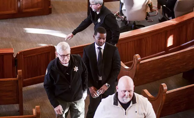 Sheldon "Timothy" Herrington Jr., who is on trial for the murder of University of Mississippi student Jimmie "Jay" Lee, leaves the courtroom as the jury is sent back for further deliberations, at the Lafayette County Courthouse in Oxford, Miss. on Wednesday, Dec. 11, 2024. (Bruce Newman/The Northeast Mississippi Daily Journal, via AP, Pool)