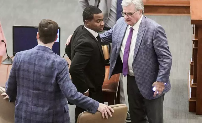 Sheldon "Timothy" Herrington Jr., center, who was on trial for the murder of University of Mississippi student Jimmie "Jay" Lee, and his defense team leave court after a mistrial was declared, at the Lafayette County Courthouse in Oxford, Miss. on Wednesday, Dec. 11, 2024. (Bruce Newman/The Northeast Mississippi Daily Journal, via AP, Pool)