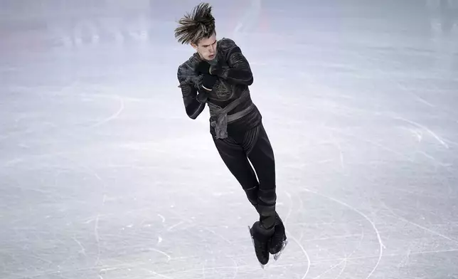 Mikhail Shaidorov, of Kazakhstan, competes in the men's short program segment at the ISU Grand Prix Finals of Figure Skating, Friday, Dec. 6, 2024, in Grenoble, France. (AP Photo/Laurent Cipriani)