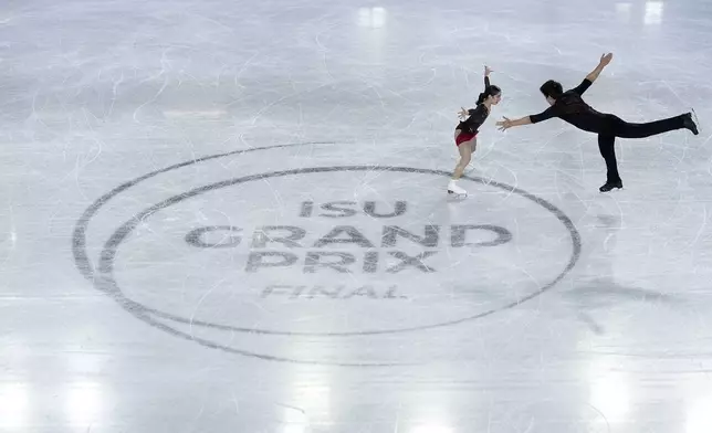 Riku Miura and Ryuichi Kihara, of Japan, compete in the pairs's free skating segment at the ISU Grand Prix Finals of Figure Skating, Friday, Dec. 6, 2024, in Grenoble, France. (AP Photo/Laurent Cipriani)