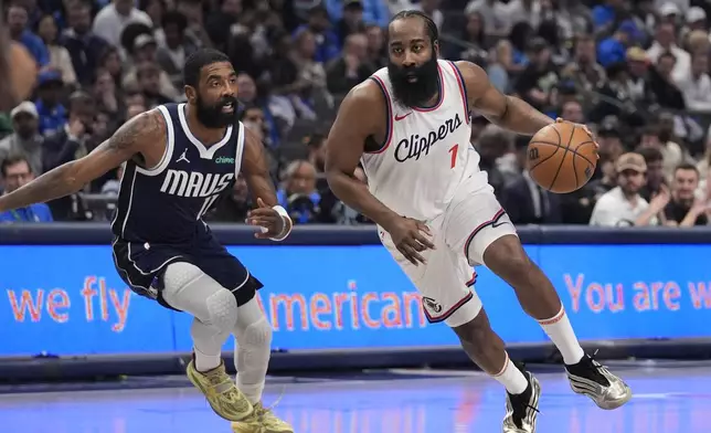 Los Angeles Clippers guard James Harden (1) drives against Dallas Mavericks guard Kyrie Irving (11) during the first period of an NBA basketball game Saturday, Dec. 21, 2024, in Dallas. (AP Photo/LM Otero)